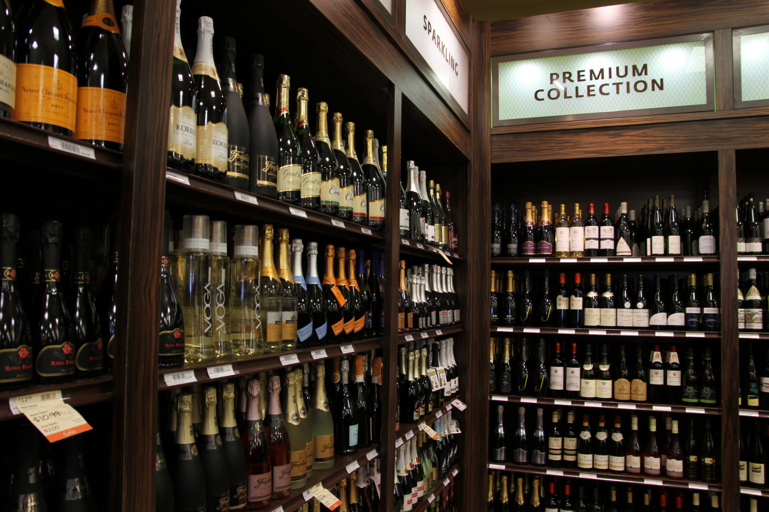 wine display, wood fixtures, retail display, signage, liquor display, gondola